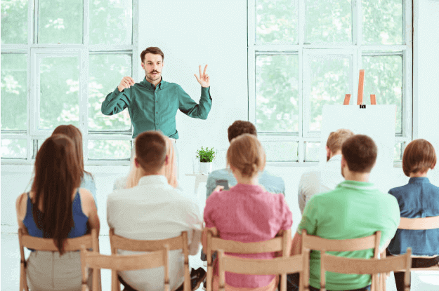 Speaker at business training in the conference hall lunch and learn training success institute australia